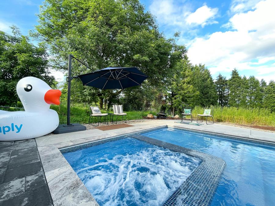 The bubbling inset hot tub with a giant rubber duck